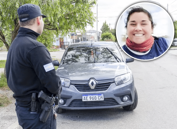  Un efectivo custodiando el auto donde ocurrió el hecho. Vanesa era de la Policía Federal. FOTO: LA OPINIÓN AUSTRAL